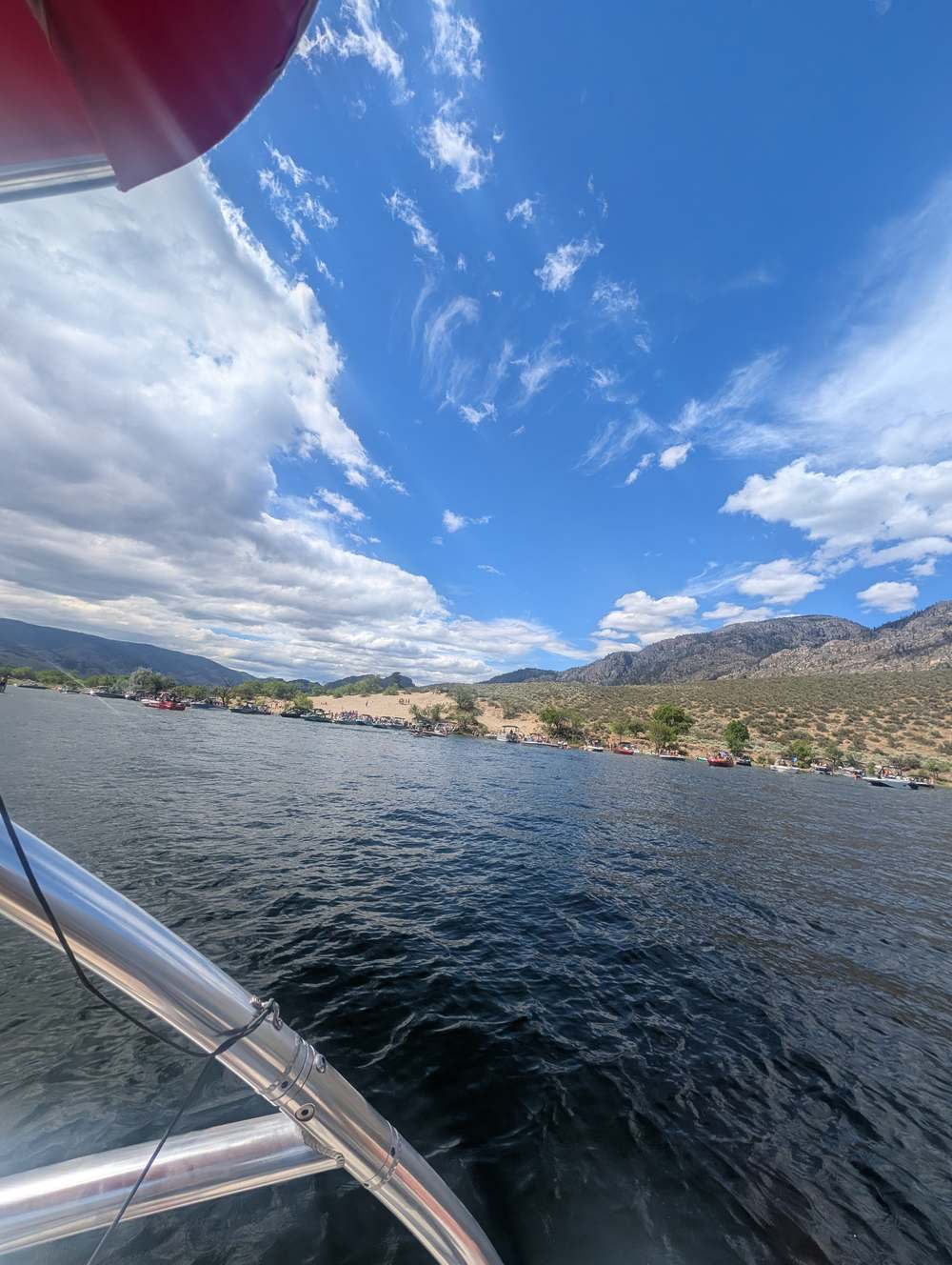 Boats and beach on Osoyoos Lake in summer